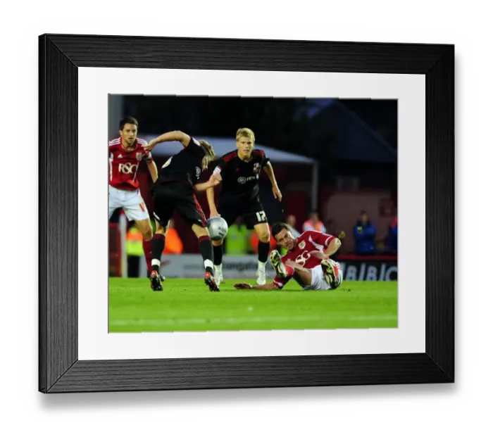 Framed Print : Bristol City vs Swindon Town: Jamie McAllister vs Simon Ferry Battle in League Cup Match, August 2011