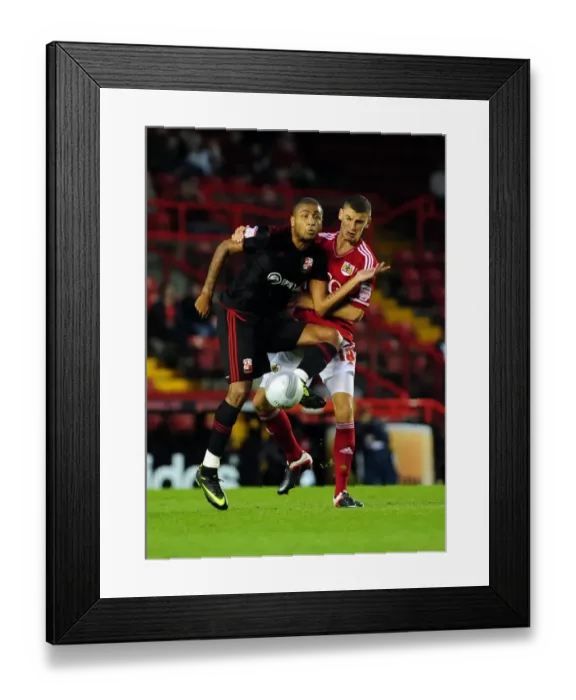 Framed Print : Bristol City vs Swindon Town: James Wilson Clashes in League Cup Match at Ashton Gate Stadium (August 2011) Framed Print : Bristol City vs Swindon Town: James Wilson Clashes in League Cup Match at Ashton Gate Stadium (August 2011)