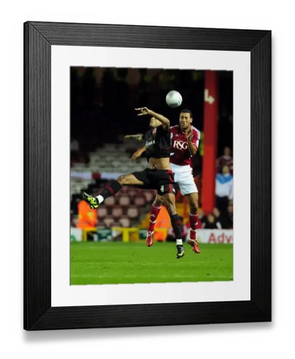 Framed Print : Bristol City vs Swindon Town: Lewin Nyatanga vs Leon Clarke in Intense League Cup Clash at Ashton Gate Stadium (August 2011) Framed Print : Bristol City vs Swindon Town: Lewin Nyatanga vs Leon Clarke in Intense League Cup Clash at Ashton Gate Stadium (August 2011)