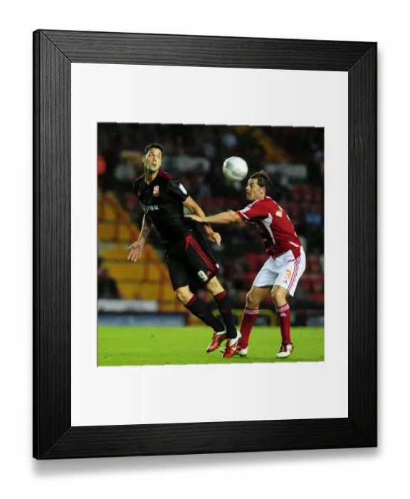 Framed Print : Battling for Supremacy: McAllister vs. Magera in the 2011 League Cup Clash between Bristol City and Swindon Town Framed Print : Battling for Supremacy: McAllister vs. Magera in the 2011 League Cup Clash between Bristol City and Swindon Town