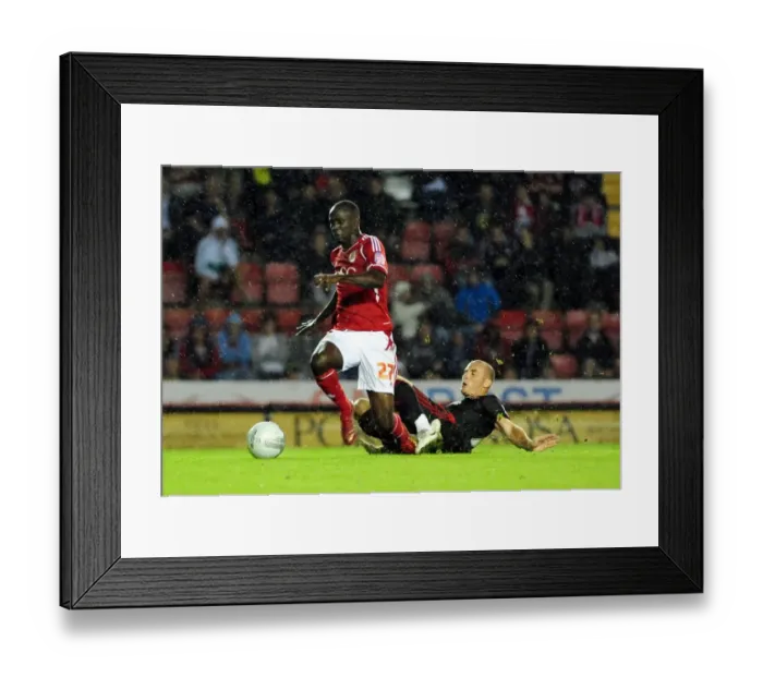 Framed Print : Bristol City's Albert Adomah Fouls by Swindon Town's Alan McCormack - League Cup Clash, 2011