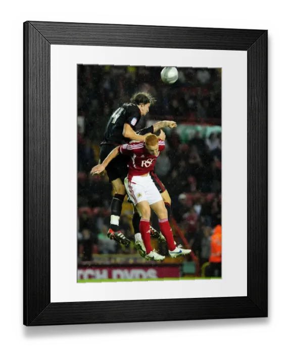 Framed Print : Battling for Supremacy: Aden Flint vs. Ryan Taylor in the 2011 League Cup Clash between Bristol City and Swindon Town Framed Print : Battling for Supremacy: Aden Flint vs. Ryan Taylor in the 2011 League Cup Clash between Bristol City and Swindon Town