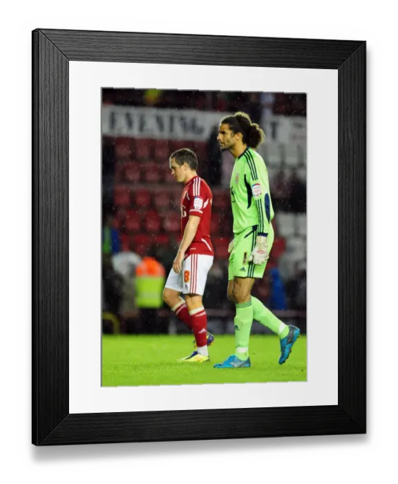 Framed Print : Disappointed David James and Neil Kilkenny Exit Ashton Gate After Bristol City's League Cup Loss to Swindon Town (August 2011) Framed Print : Disappointed David James and Neil Kilkenny Exit Ashton Gate After Bristol City's League Cup Loss to Swindon Town (August 2011)