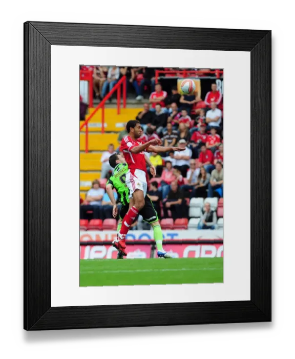 Framed Print : Bristol City vs Brighton: Lewin Nyatanga vs Ashley Barnes Battle for the Ball in Championship Match, September 10, 2011 - Editorial Use Only