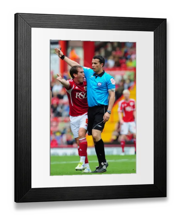 Framed Print : Bristol City's Neil Kilkenny Disputes Call with Referee Whitestone during Championship Match vs. Brighton (10-09-2011) Framed Print : Bristol City's Neil Kilkenny Disputes Call with Referee Whitestone during Championship Match vs. Brighton (10-09-2011)