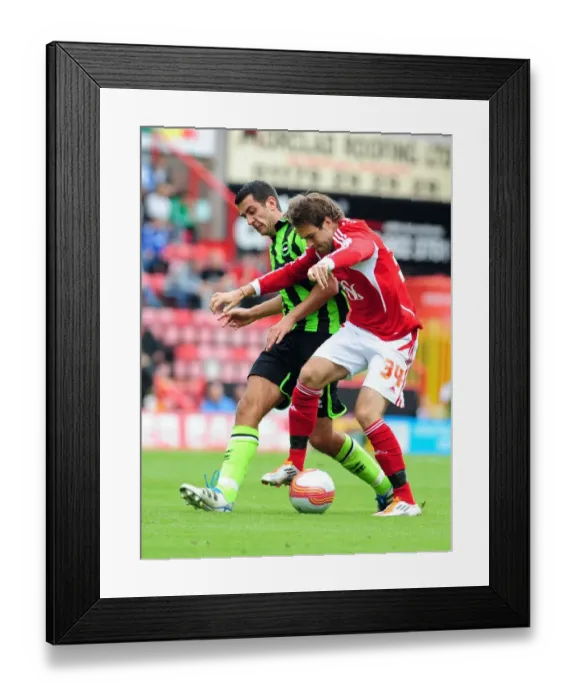 Framed Print : Brett Pitman vs. Marcos Painter: Intense Battle in the Championship Match between Bristol City and Brighton (September 10, 2011) Framed Print : Brett Pitman vs. Marcos Painter: Intense Battle in the Championship Match between Bristol City and Brighton (September 10, 2011)