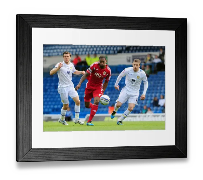 Framed Print : Marvin Elliott vs. Adam Clayton: Battle for the Ball in Leeds United vs. Bristol City League Cup Clash - 16 / 09 / 2011