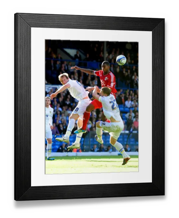 Framed Print : Battling for the Ball: Marvin Elliott vs. Becchio and Somma in the Intense 2011 League Cup Clash between Leeds United and Bristol City Framed Print : Battling for the Ball: Marvin Elliott vs. Becchio and Somma in the Intense 2011 League Cup Clash between Leeds United and Bristol City