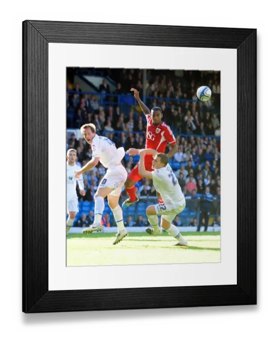 Framed Print : Battling for Control: Elliott vs. Becchio and Somma in the Intense 2011 League Cup Clash between Leeds United and Bristol City