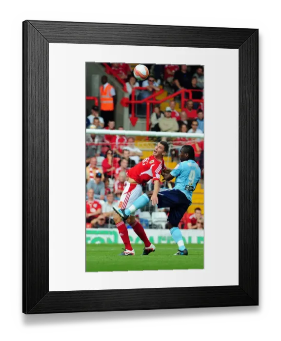 Framed Print : Bristol City's James Wilson Foul by Hull City's Aaron Mclean in Championship Match - September 2011 Framed Print : Bristol City's James Wilson Foul by Hull City's Aaron Mclean in Championship Match - September 2011