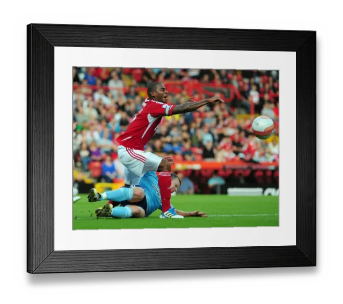 Framed Print : Bristol City's Marvin Elliott Fouls by Hull City's Paul McKenna in Championship Match, September 2011