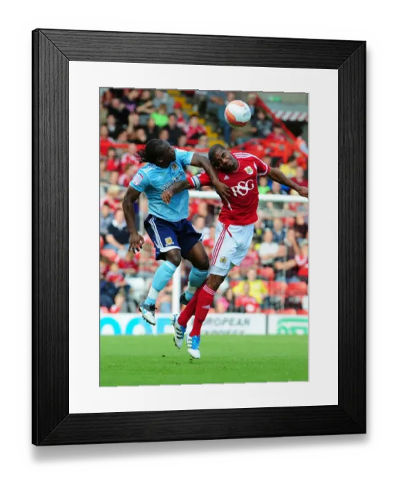 Framed Print : Championship Showdown: Marvin Elliott vs. Aaron Mclean - September 2011 - Bristol City vs. Hull City Framed Print : Championship Showdown: Marvin Elliott vs. Aaron Mclean - September 2011 - Bristol City vs. Hull City