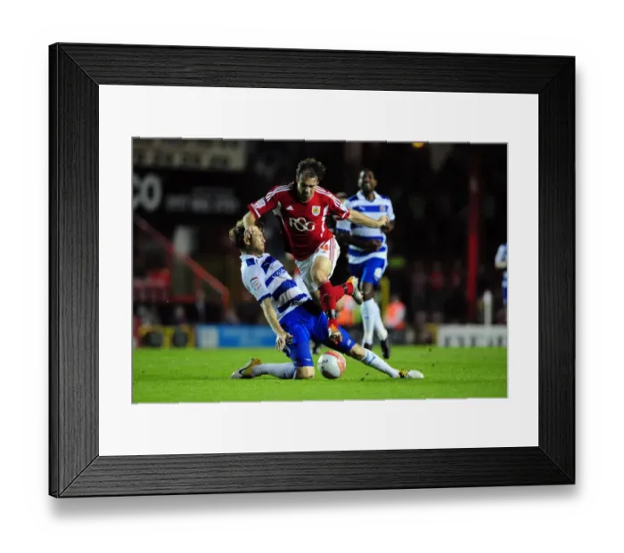 Framed Print : Bristol City's Brett Pitman Fouled by Kaspars Gorkss in Championship Match against Reading (September 27, 2011) Framed Print : Bristol City's Brett Pitman Fouled by Kaspars Gorkss in Championship Match against Reading (September 27, 2011)