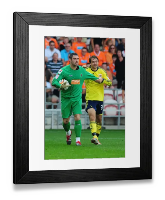 Framed Print : Bristol City's Brett Pitman Slips Against Blackpool's Matthew Gilks - League Cup Match, 01 / 10 / 2011 Framed Print : Bristol City's Brett Pitman Slips Against Blackpool's Matthew Gilks - League Cup Match, 01 / 10 / 2011