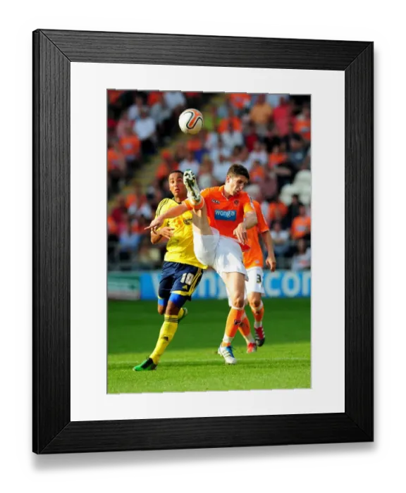 Framed Print : Blackpool's Craig Cathcart Clears Under Pressure from Nicky Maynard in League Cup Clash with Bristol City - 01 / 10 / 2011 Framed Print : Blackpool's Craig Cathcart Clears Under Pressure from Nicky Maynard in League Cup Clash with Bristol City - 01 / 10 / 2011