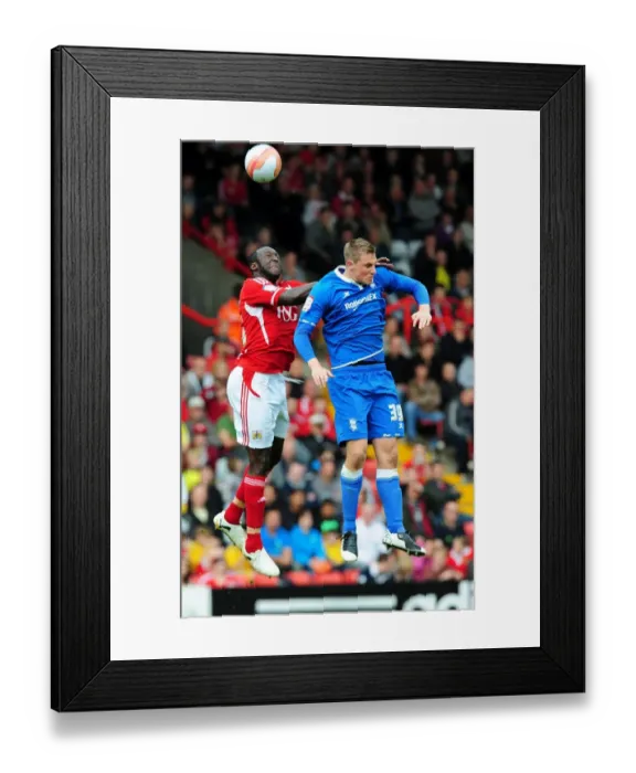 Framed Print : Championship Showdown: Damion Stewart vs Chris Wood - A High Ball Battle at Ashton Gate, 23rd October 2011 (Editorial Use Only) Framed Print : Championship Showdown: Damion Stewart vs Chris Wood - A High Ball Battle at Ashton Gate, 23rd October 2011 (Editorial Use Only)