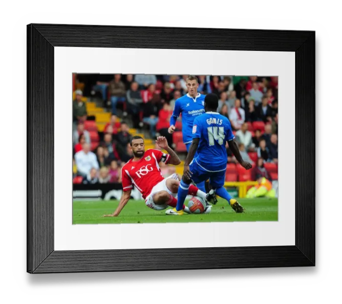 Framed Print : Bristol City's Liam Fontaine Tackles Morgaro Gomis in Championship Match vs Birmingham City - October 23, 2011