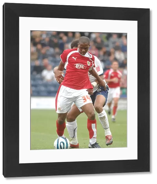 Darren Byfield tries to wrigggle past the preston defence