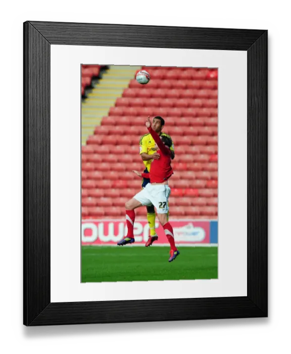 Framed Print : Barnsley vs. Bristol City: Lewin Nyatanga vs. Andy Gray - Championship Clash at Oakwell Stadium, October 2011