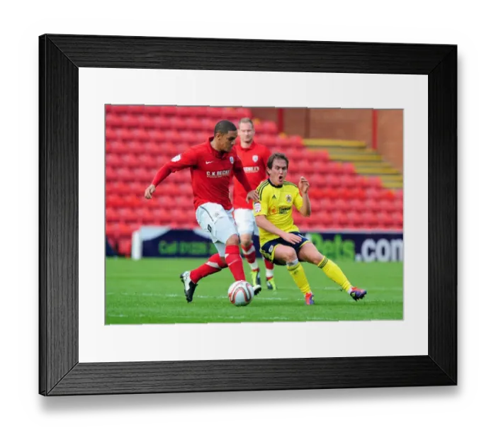 Framed Print : Neil Kilkenny vs. Nathan Doyle: Intense Battle for the Ball in the 2011 Championship Match between Barnsley and Bristol City Framed Print : Neil Kilkenny vs. Nathan Doyle: Intense Battle for the Ball in the 2011 Championship Match between Barnsley and Bristol City