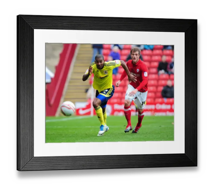 Framed Print : Marvin Elliott Chases Ball in Championship Match: Barnsley vs. Bristol City (2011)