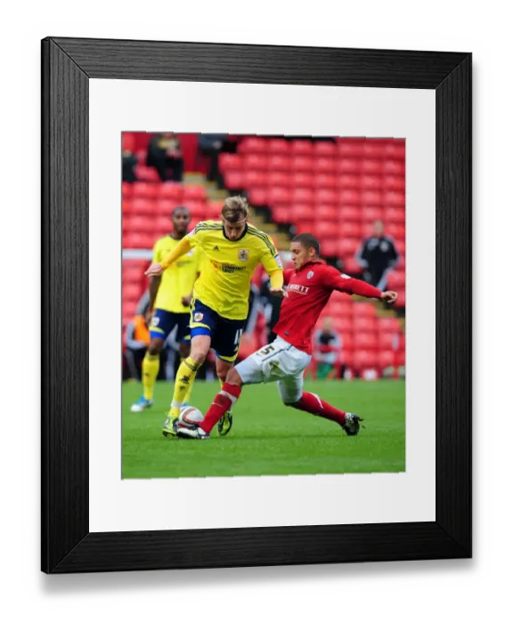 Framed Print : Battling for Championship Supremacy: Woolford vs. Doyle at Oakwell Stadium Framed Print : Battling for Championship Supremacy: Woolford vs. Doyle at Oakwell Stadium