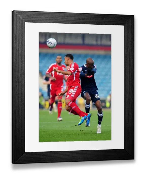 Framed Print : Battling for Supremacy: Nicky Maynard vs. Jimmy Abdou in Millwall vs. Bristol City Championship Clash (November 2011)