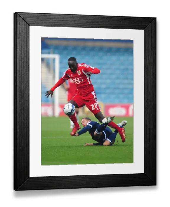 Framed Print : Bristol City's Albert Adomah Dodges Brian Howard's Challenge: Millwall vs. Bristol City, Championship 2011 (Editorial Use Only) Framed Print : Bristol City's Albert Adomah Dodges Brian Howard's Challenge: Millwall vs. Bristol City, Championship 2011 (Editorial Use Only)