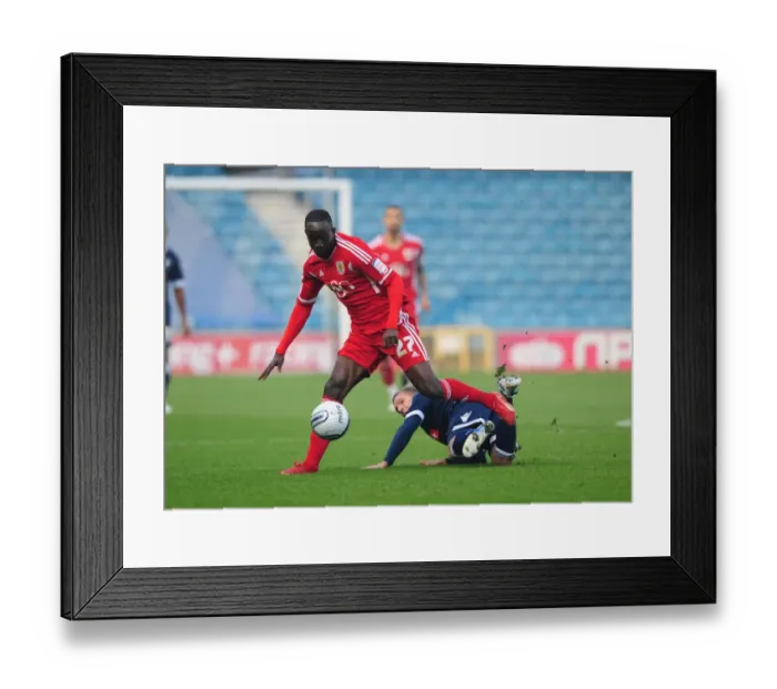 Framed Print : Bristol City's Albert Adomah Dodges Brian Howard's Challenge: Millwall vs. Bristol City, Championship 2011 - Editorial Use Only