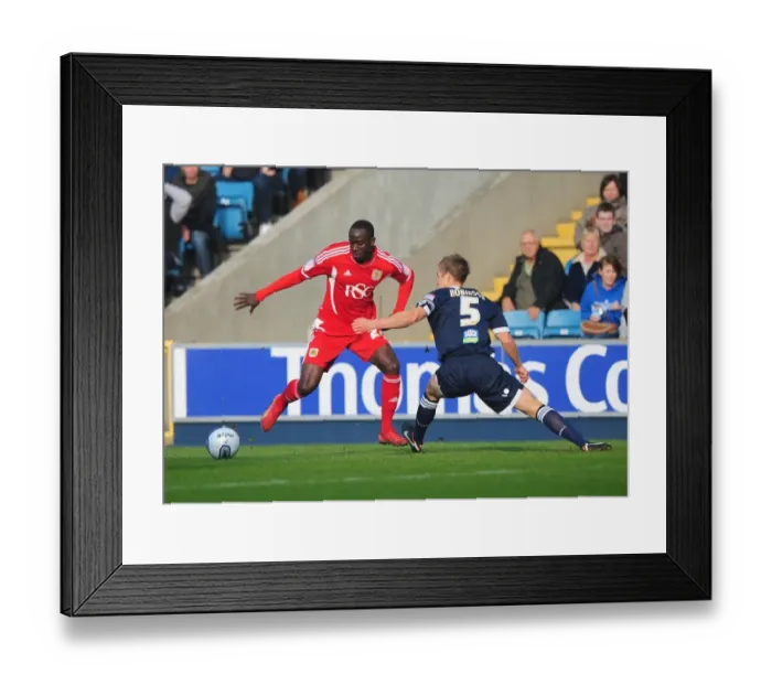 Framed Print : Adomah Outmaneuvers Robinson: Millwall vs. Bristol City Championship Clash (November 2011)