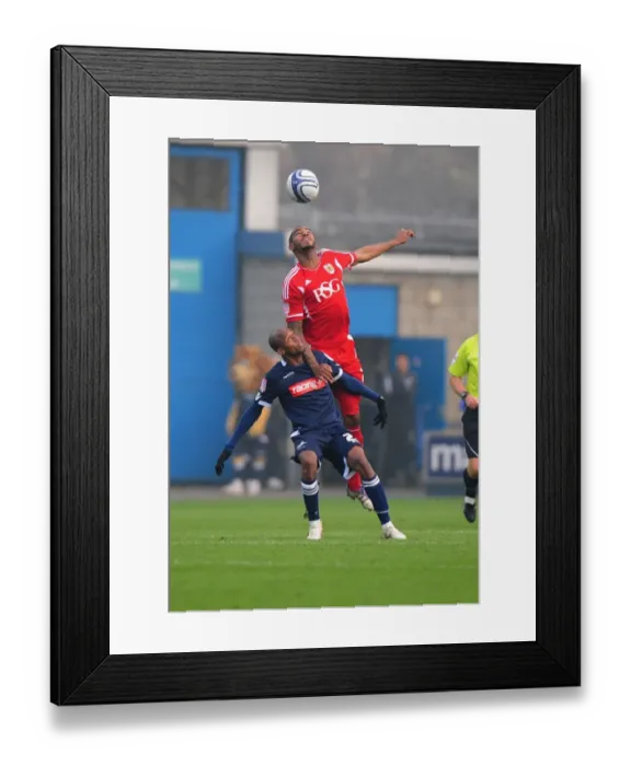 Framed Print : Bristol City's Marvin Elliott vs. Jimmy Abdou: A Battle for Supremacy in the Millwall vs. Bristol City Championship Clash at Selhurst Park (November 2011) Framed Print : Bristol City's Marvin Elliott vs. Jimmy Abdou: A Battle for Supremacy in the Millwall vs. Bristol City Championship Clash at Selhurst Park (November 2011)