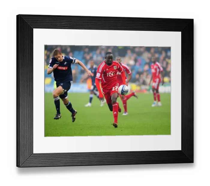 Framed Print : Albert Adomah Slips Past Paul Robinson: Millwall vs. Bristol City Championship Clash (November 2011) Framed Print : Albert Adomah Slips Past Paul Robinson: Millwall vs. Bristol City Championship Clash (November 2011)