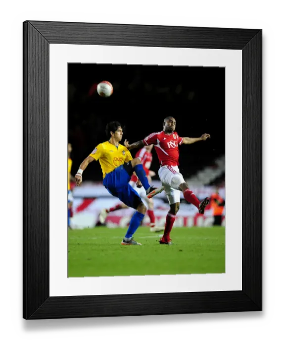 Framed Print : Championship Showdown: Marvin Elliott vs. Jose Fonte at Ashton Gate Stadium (November 26, 2011)