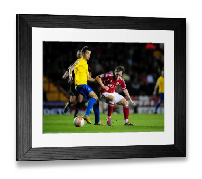 Framed Print : Neil Kilkenny vs. Jack Cork: Battle for the Ball in Bristol City vs. Southampton Championship Match, 26 / 11 / 2011