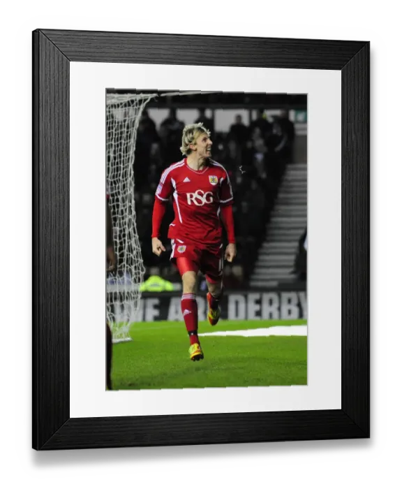Framed Print : Martyn Woolford Scores Game-Winning Goal for Bristol City against Derby County in Championship Match (10th December 2011) Framed Print : Martyn Woolford Scores Game-Winning Goal for Bristol City against Derby County in Championship Match (10th December 2011)
