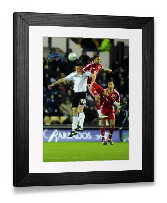 Framed Print : Battling for the High Ball: Liam Fontaine vs. Callum Ball - Derby County vs. Bristol City Championship Clash (10 / 12 / 2011) Framed Print : Battling for the High Ball: Liam Fontaine vs. Callum Ball - Derby County vs. Bristol City Championship Clash (10 / 12 / 2011)