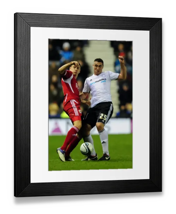 Framed Print : Bristol City's James Wilson vs Callum Ball in Championship Clash at Derby County, 10 / 12 / 2011
