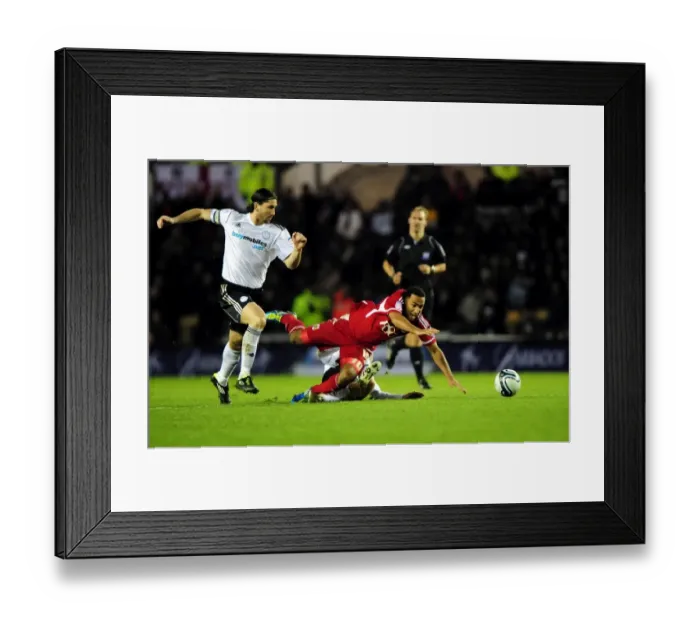 Framed Print : Bristol City's Nicky Maynard Fouls by Craig Bryson in Derby County Championship Clash (10th December 2011) Framed Print : Bristol City's Nicky Maynard Fouls by Craig Bryson in Derby County Championship Clash (10th December 2011)