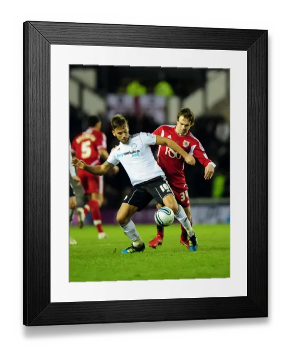 Framed Print : Battling for Supremacy: Brett Pitman vs. James Bailey in Derby County vs. Bristol City Championship Clash - 10 / 12 / 2011 Framed Print : Battling for Supremacy: Brett Pitman vs. James Bailey in Derby County vs. Bristol City Championship Clash - 10 / 12 / 2011