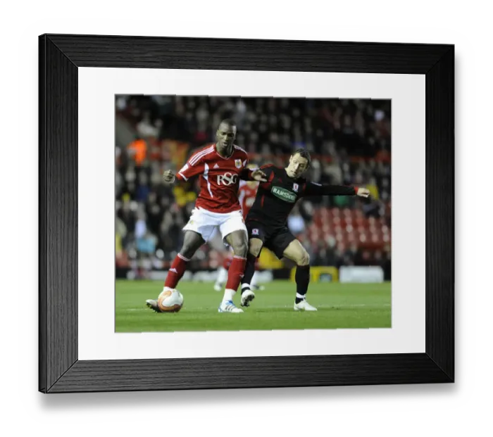Framed Print : Bristol City's Kalifa Cisse Fends Off Scott McDonald in Bristol City v Middlesbrough Match, December 2011