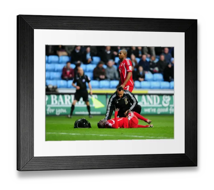 Framed Print : Albert Adomah Receives Penalty Area Treatment During Coventry City vs. Bristol City Championship Match, 26 / 12 / 2011