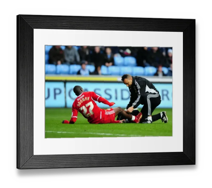 Framed Print : Bristol City's Albert Adomah Receives Penalty Area Treatment in Coventry City vs. Bristol City Championship Match (December 2011) Framed Print : Bristol City's Albert Adomah Receives Penalty Area Treatment in Coventry City vs. Bristol City Championship Match (December 2011)