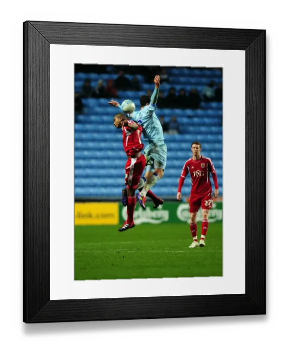 Framed Print : Battling for Supremacy: Marvin Elliott vs. Richard Keogh in Coventry City vs. Bristol City Championship Clash (December 26, 2011) Framed Print : Battling for Supremacy: Marvin Elliott vs. Richard Keogh in Coventry City vs. Bristol City Championship Clash (December 26, 2011)