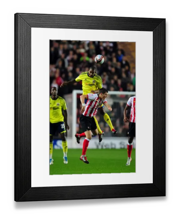 Framed Print : Battling for Supremacy: Marvin Elliott vs. Morgan Schneiderlin in Southampton vs. Bristol City Championship Clash (December 2011)