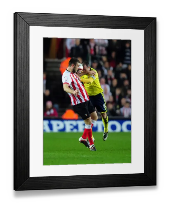 Framed Print : Battling for Supremacy: Louis Carey vs. Rickie Lambert in Southampton v Bristol City Championship Clash (December 2011) Framed Print : Battling for Supremacy: Louis Carey vs. Rickie Lambert in Southampton v Bristol City Championship Clash (December 2011)