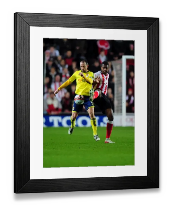 Framed Print : Battling for the Ball: Louis Carey vs. Guilherme do Prado in Southampton vs. Bristol City Championship Clash (December 2011) Framed Print : Battling for the Ball: Louis Carey vs. Guilherme do Prado in Southampton vs. Bristol City Championship Clash (December 2011)