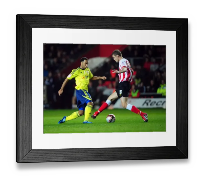 Framed Print : Nicky Maynard Outmaneuvers Jos Hooiveld in Championship Clash: Southampton vs. Bristol City (30 / 12 / 2011) Framed Print : Nicky Maynard Outmaneuvers Jos Hooiveld in Championship Clash: Southampton vs. Bristol City (30 / 12 / 2011)