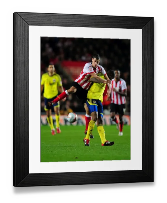 Framed Print : Southampton's Morgan Schneiderlin Fouls Marvin Elliott in Championship Clash between Southampton and Bristol City (30 / 12 / 2011) Framed Print : Southampton's Morgan Schneiderlin Fouls Marvin Elliott in Championship Clash between Southampton and Bristol City (30 / 12 / 2011)