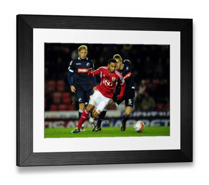 Framed Print : Bristol City's Nicky Maynard vs. Millwall's Paul Robinson - Championship Clash at Ashton Gate Stadium, January 3, 2012
