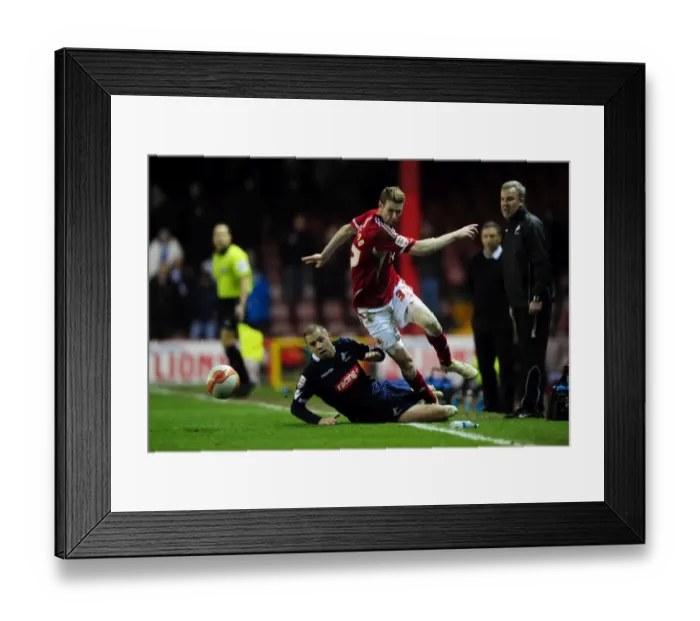 Framed Print : Bristol City's Stephen Pearson Dodges Tackle from Millwall's Alan Dunne - Championship Match (03 / 01 / 2012)